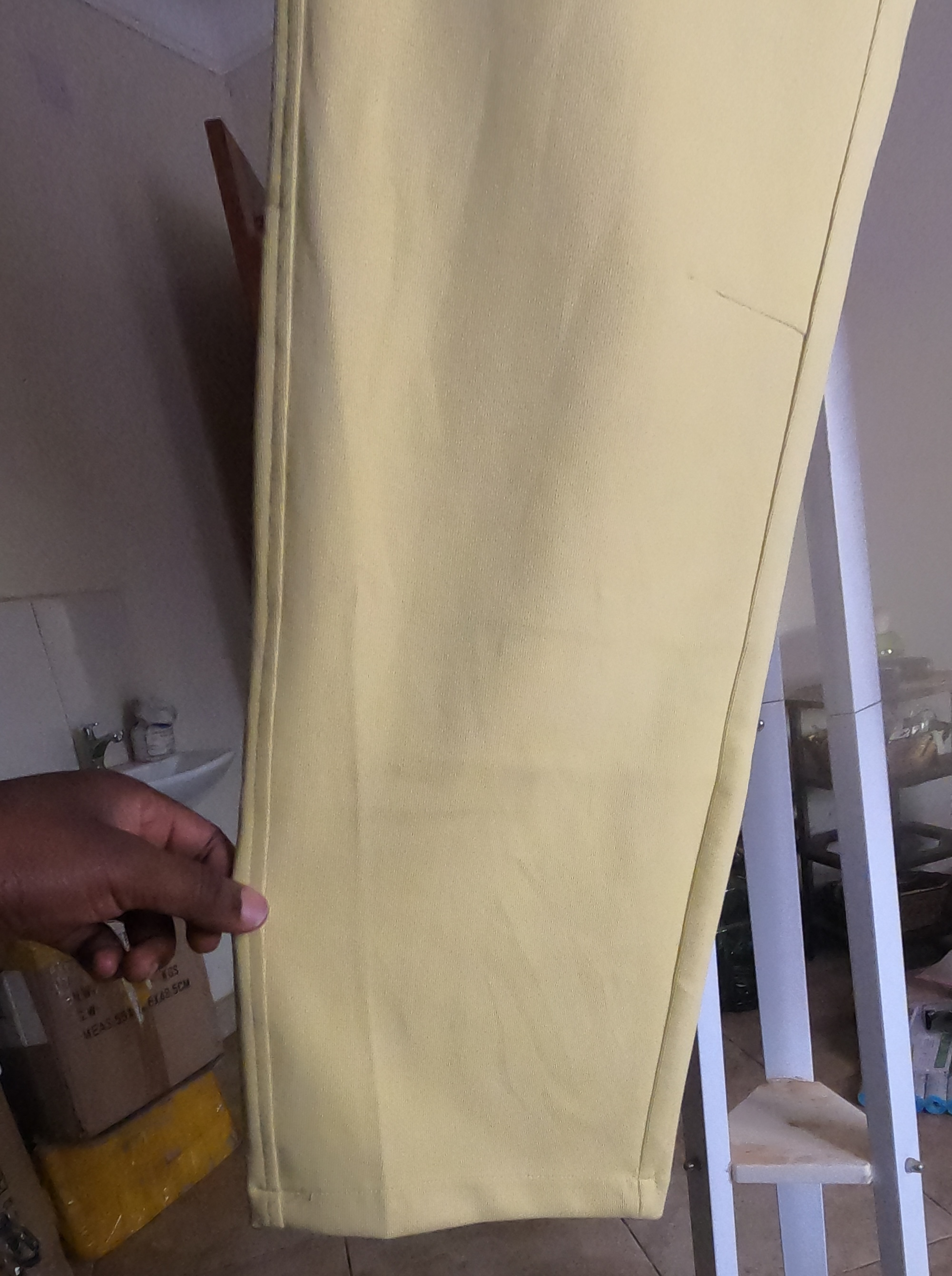 Customer-supplied detail photograph of the yellow trousers